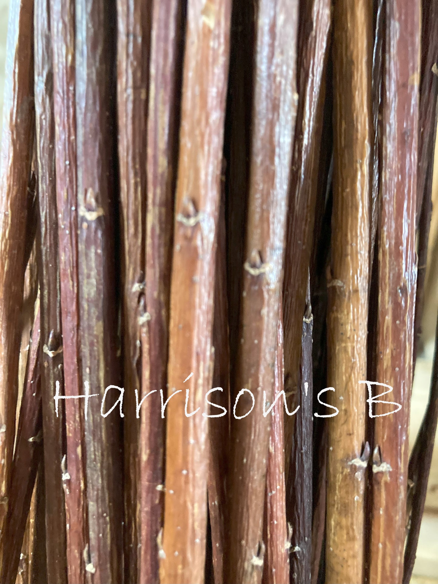 Close-up of brown sticks with 'Harrisons B' branding.